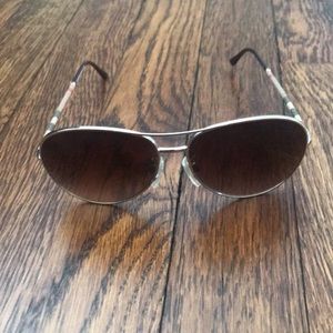 Burberry gold framed sunglasses.
